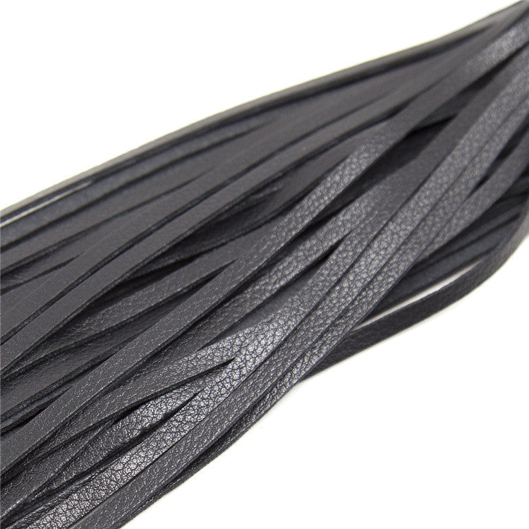 Close-up of Leather Love Whip, a stylish BDSM whip for adult play and roleplay, ideal for enhancing your experience.