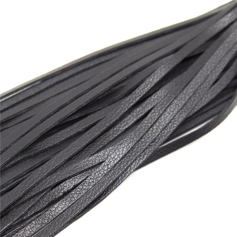 Close-up of Leather Love Whip, a stylish BDSM whip for adult play and roleplay, ideal for enhancing your experience.