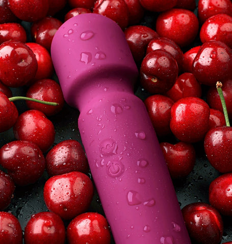 SilkPulse Eight vibrator surrounded by fresh red cherries and water droplets for added appeal.