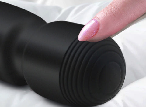 Close-up of AquaVibe Twelve waterproof vibrator, showcasing design and finger touch for stimulation.