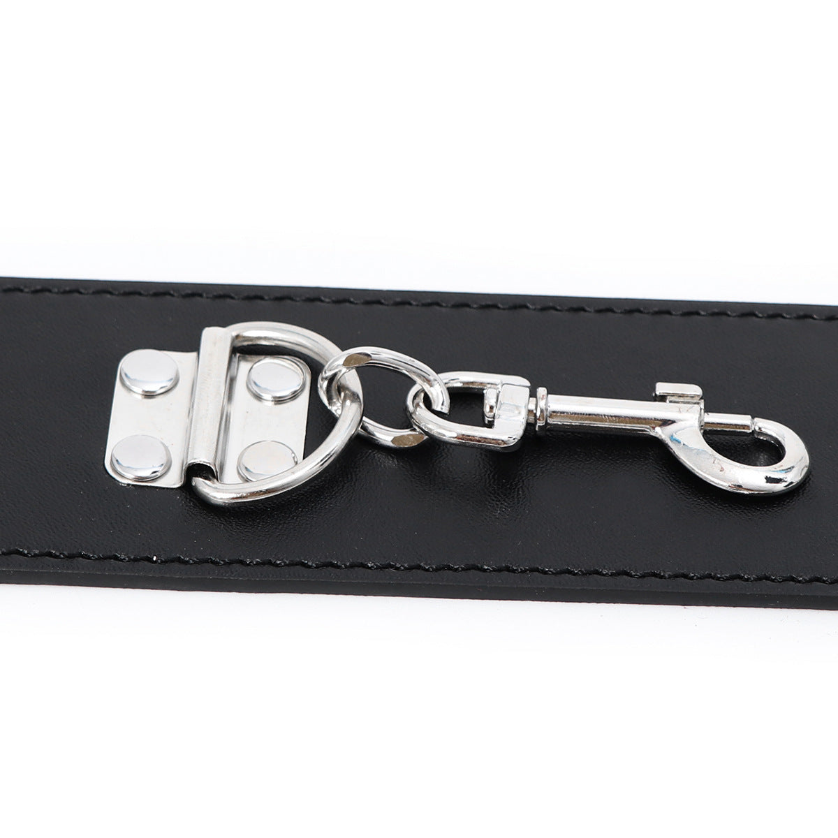 Close-up of the metal clasp on Midnight Desire leather handcuffs, part of a sexy adult bondage set.