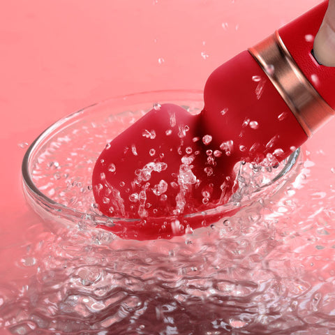 Velura Wand splashing in water, showcasing its sleek design and versatility as a powerful vibrator.