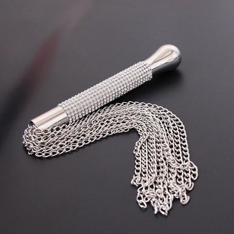 Elegant Love Whip with metal handle and chain, perfect for BDSM and flirtatious scenarios.