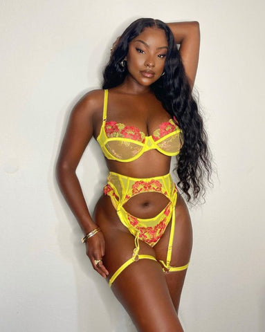 Three-piece Lingerie in vibrant yellow and floral design, perfect for intimate moments and playful adventures.