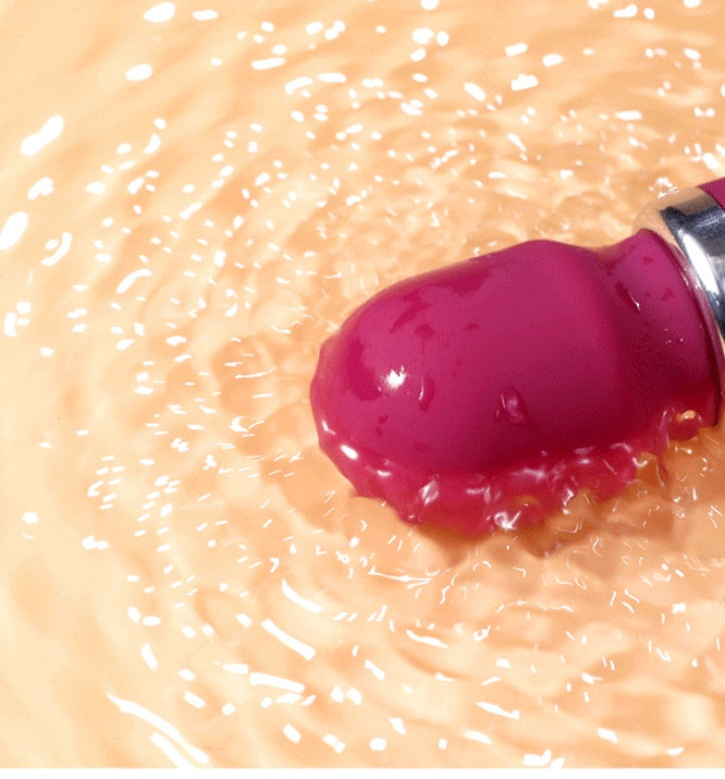 SilkPulse Eight vibrator floating in water, showcasing its waterproof design and vibrant color.