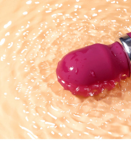 SilkPulse Eight vibrator floating in water, showcasing its waterproof design and vibrant color.