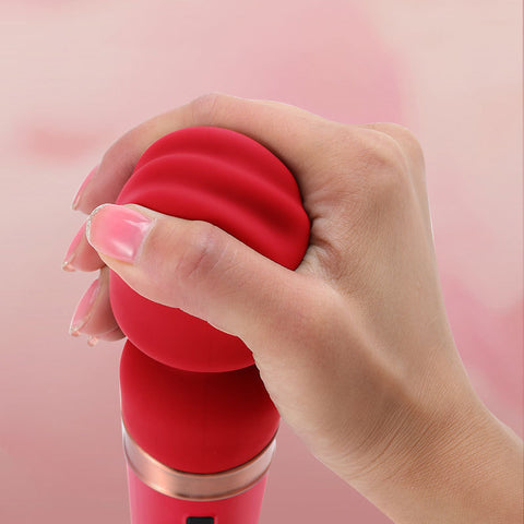 Velura Wand in hand, showcasing its ergonomic design for enhanced pleasure with vibratorer and sexleketøy.